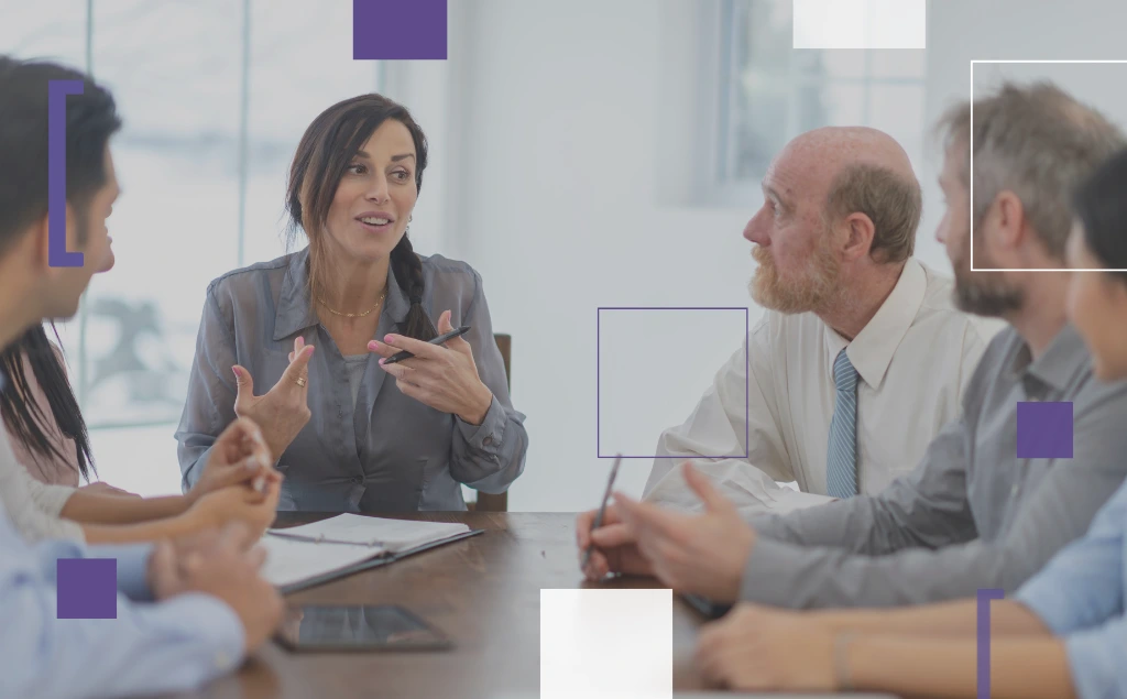corporate law professionals in a meeting with IPRO visuals overlaid